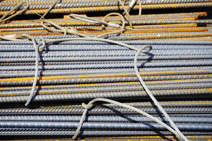 Stack of rebar and steel rods in yard